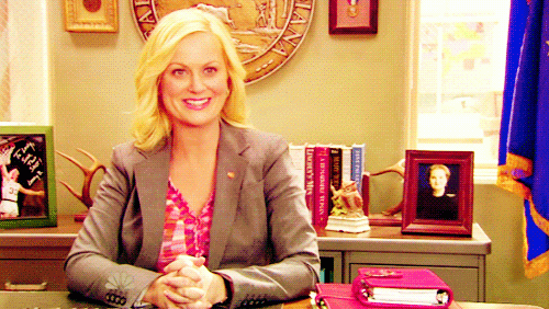 Leslie Knope is excited and smiling over her love of waffles.