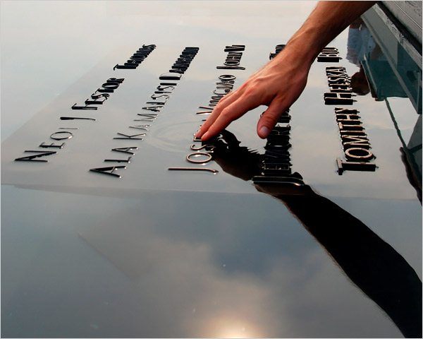 touching the Twin Towers memorial, graphic designers
